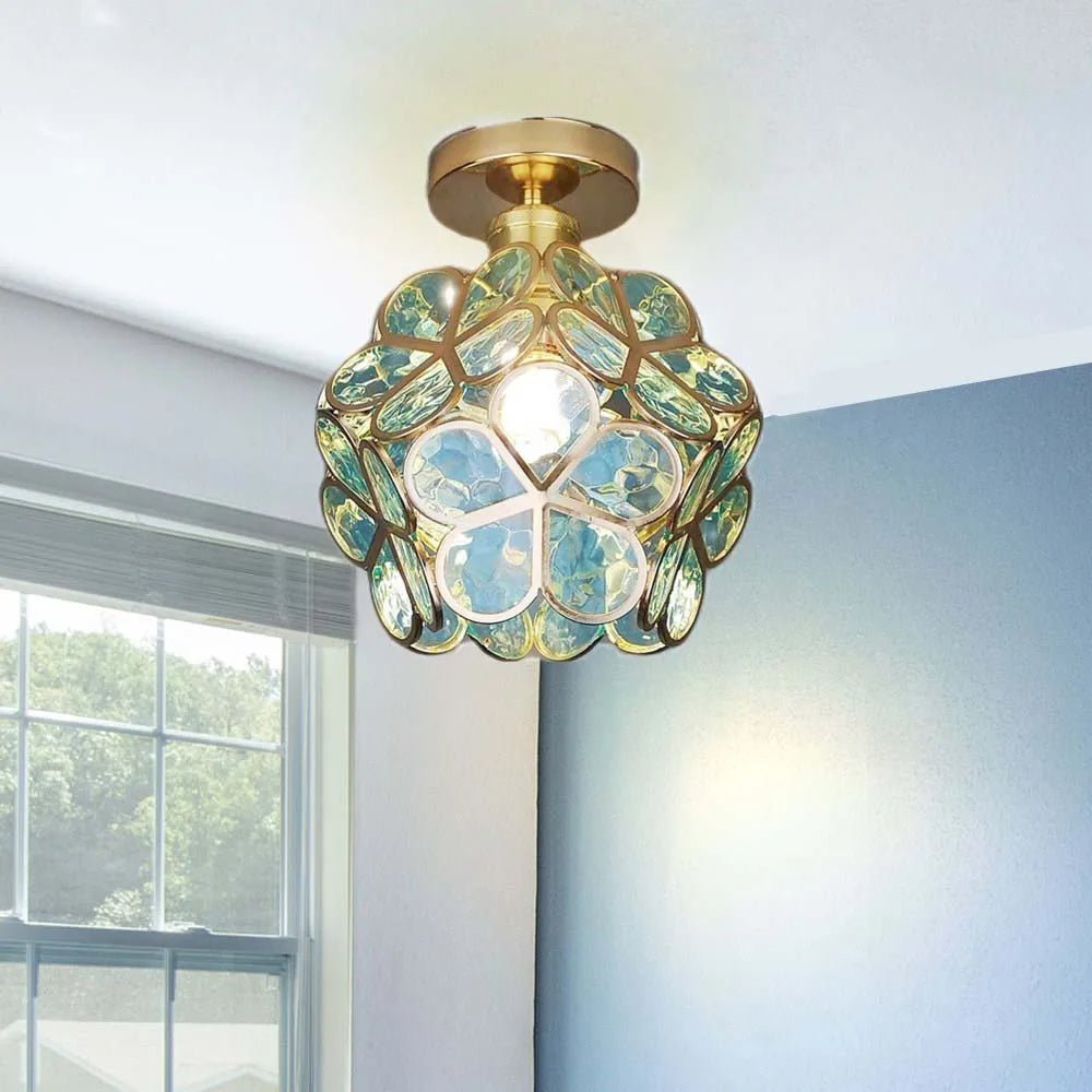 Floral glass ceiling light with light reflection