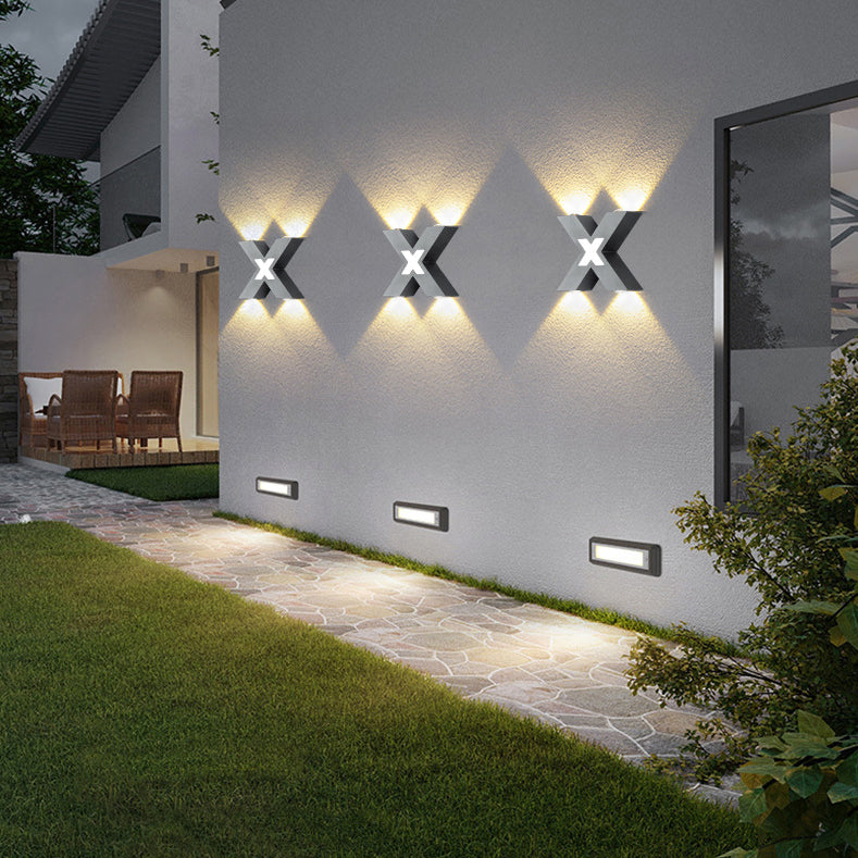 Modern waterproof LED outdoor spotlight in X-design for facade lighting