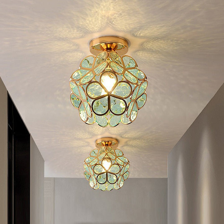 Floral glass ceiling light with light reflection