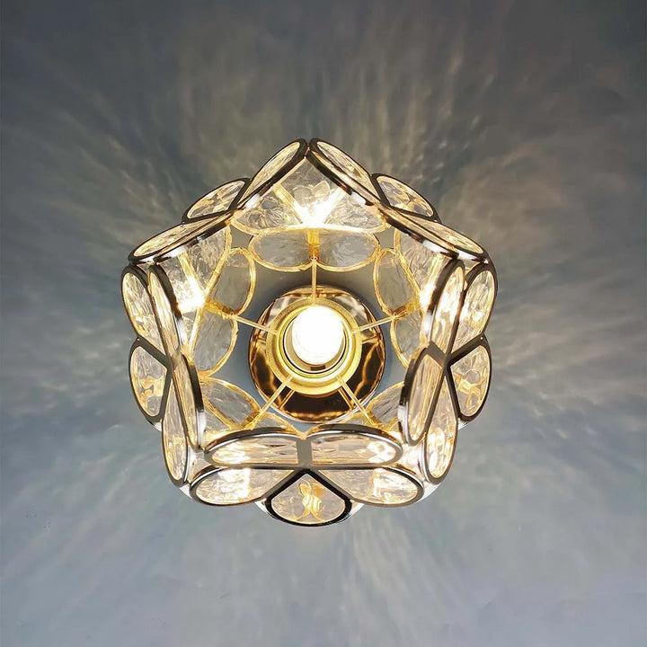 Floral glass ceiling light with light reflection