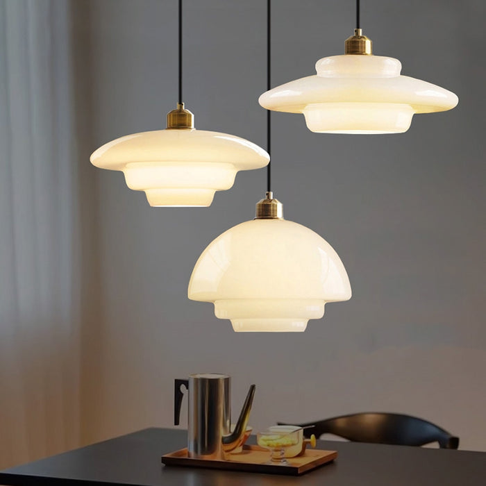 Mid-century style pendant lamp made of frosted glass with brass detail