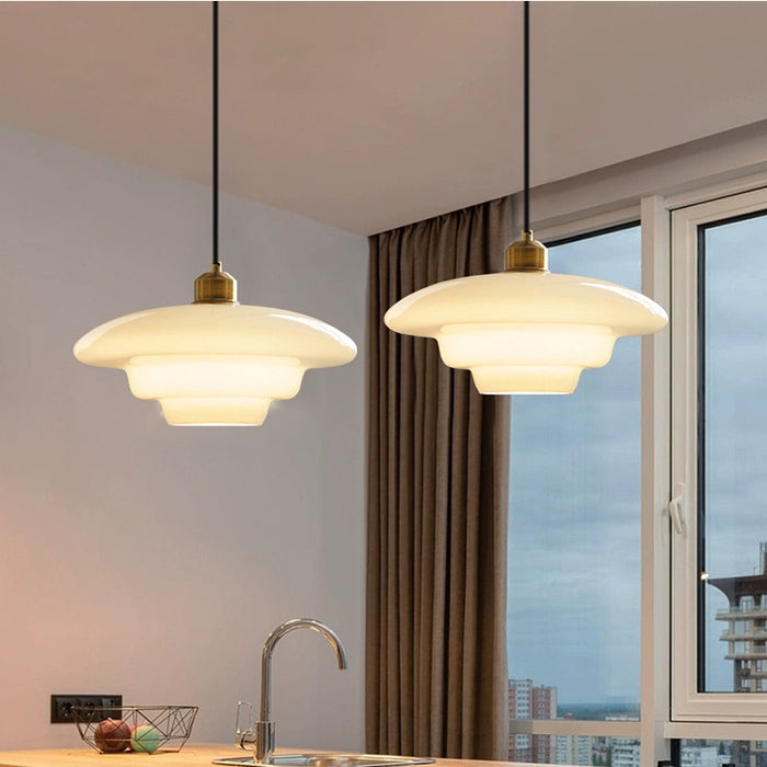 Mid-century style pendant lamp made of frosted glass with brass detail