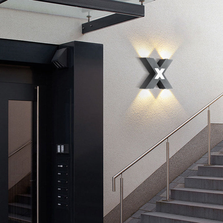 Modern waterproof LED outdoor spotlight in X-design for facade lighting