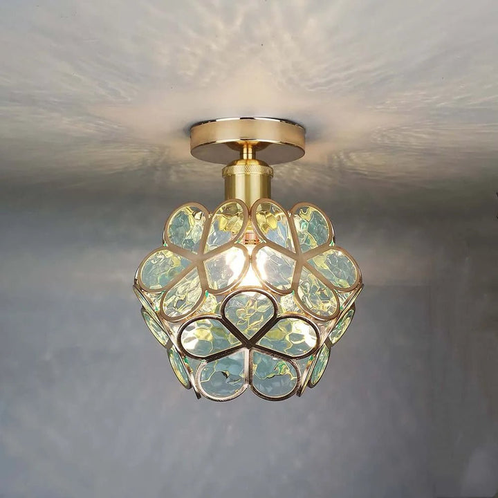 Floral glass ceiling light with light reflection