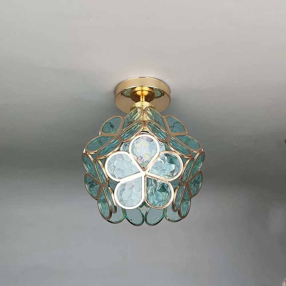 Floral glass ceiling light with light reflection