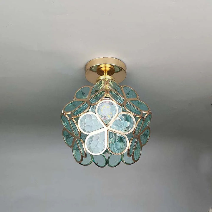 Floral glass ceiling light with light reflection