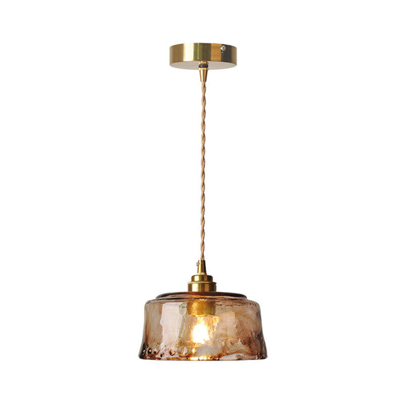 Rustic pendant light with amber-colored alabaster glass