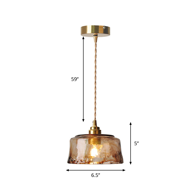 Rustic pendant light with amber-colored alabaster glass