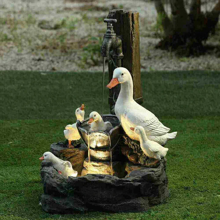 Playful decorative garden fountain with duck motif for outdoor areas