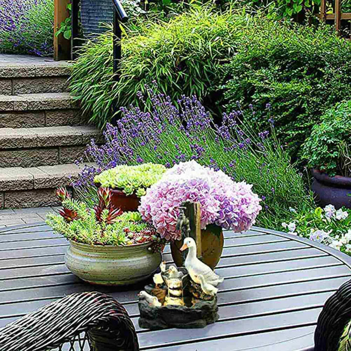 Playful decorative garden fountain with duck motif for outdoor areas