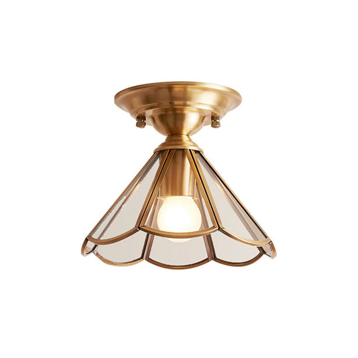 Simple ceiling light with a wavy edge in brass