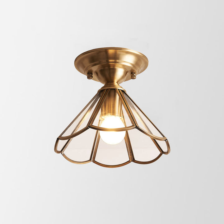 Simple ceiling light with a wavy edge in brass