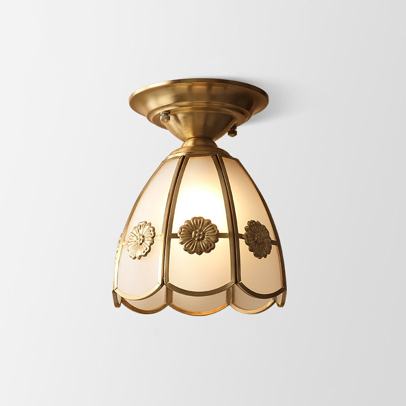 Simple ceiling light with a wavy edge in brass