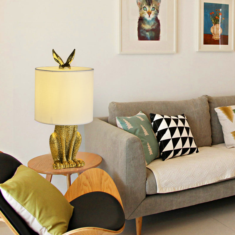 Masked Rabbit bedside lamp made of resin with fabric shade 