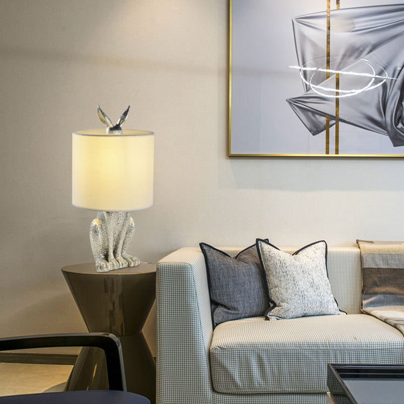 Masked Rabbit bedside lamp made of resin with fabric shade 