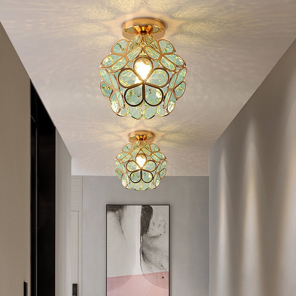 Floral glass ceiling light with light reflection