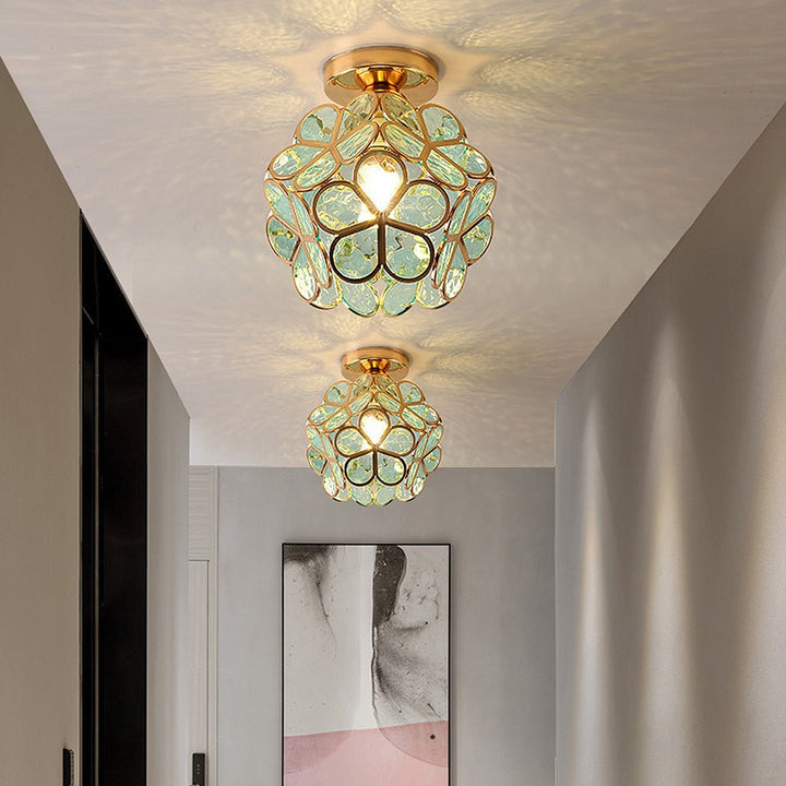Floral glass ceiling light with light reflection