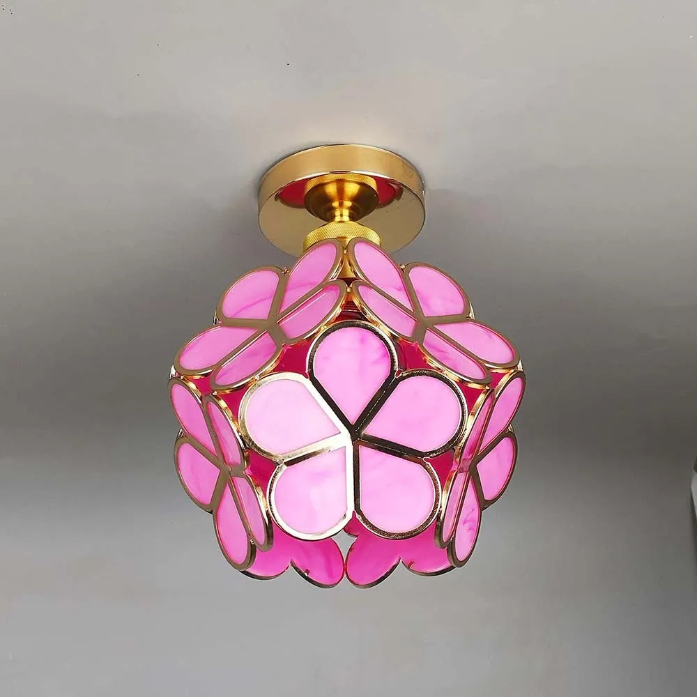 Floral glass ceiling light with light reflection