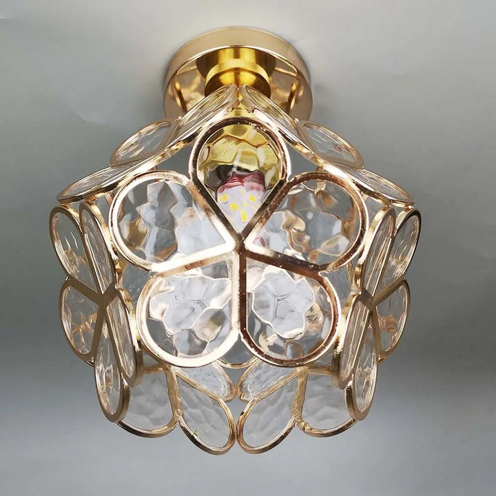 Floral glass ceiling light with light reflection