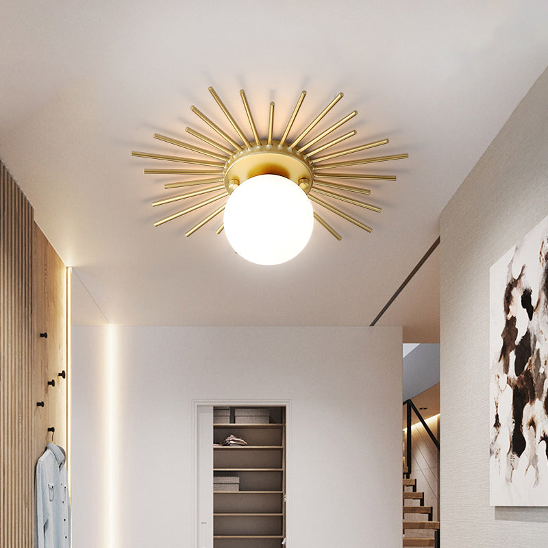 Ceiling light with frosted glass body in a gold-colored design