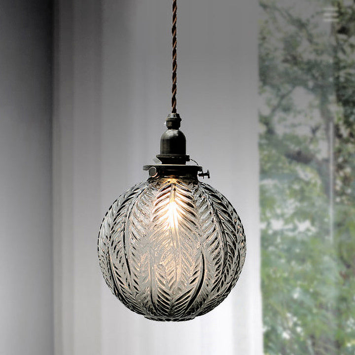 Pendant lamp with glass and feather motif – clear or smoked glass