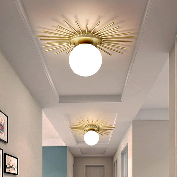Ceiling light with frosted glass body in a gold-colored design