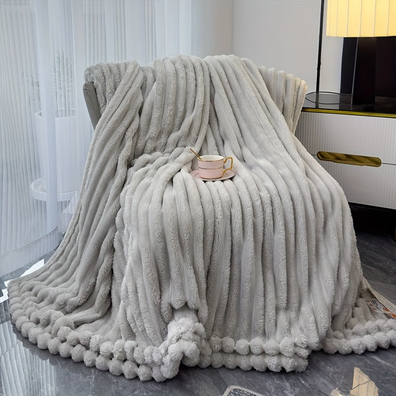 Sofa blanket with plush look