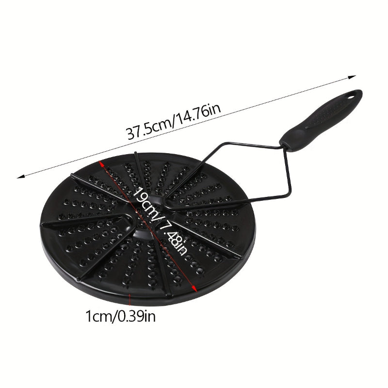 Black cast iron heat distribution pad for even cooking on a gas stove