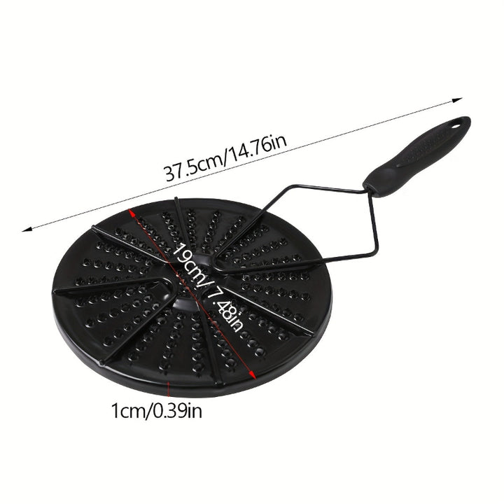 Black cast iron heat distribution pad for even cooking on a gas stove