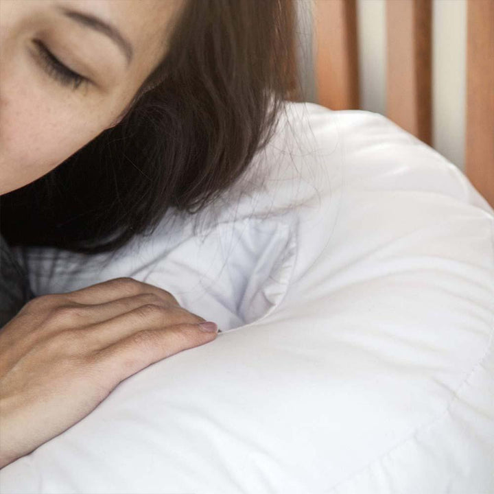 Side sleeper pillow with ear recess