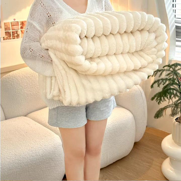 Fleece cuddly blanket with ribbed design