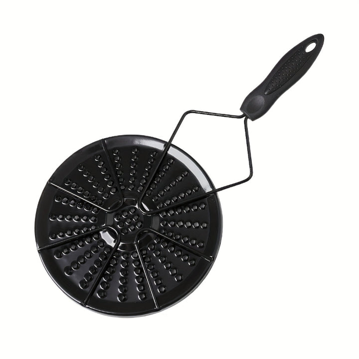 Black cast iron heat distribution pad for even cooking on a gas stove