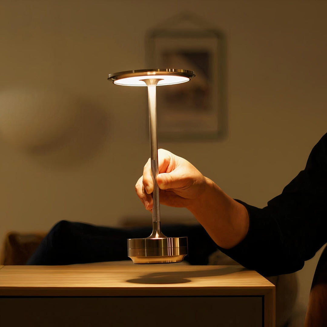 Wireless dimmable designer table lamp in an elegant design