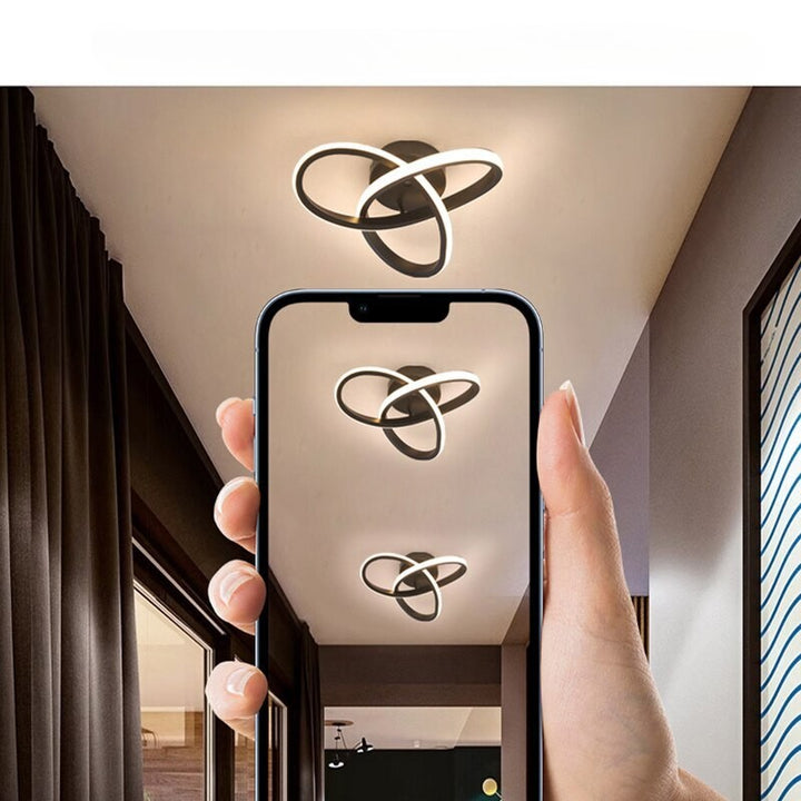Modern LED ceiling light with three rings in a sculptural design