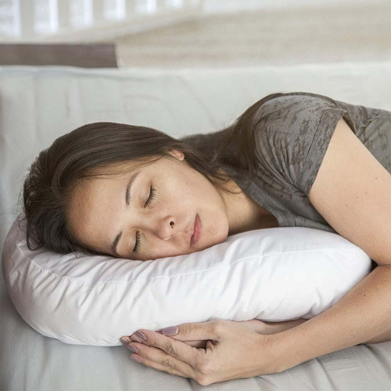 Side sleeper pillow with ear recess