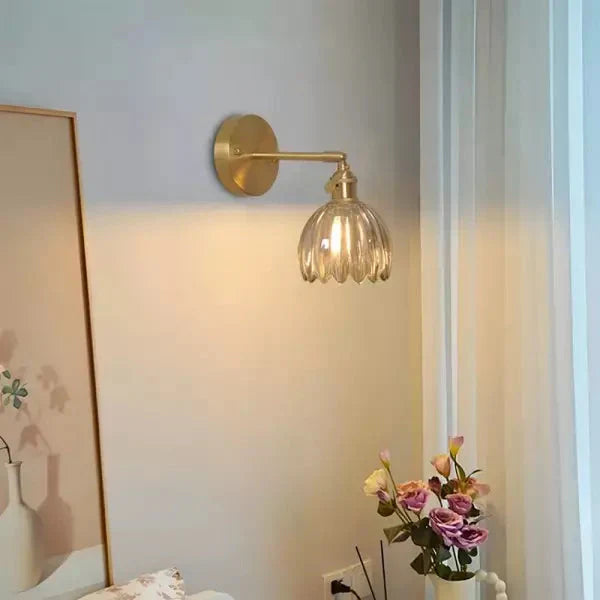 Wall lamp with tulip-shaped glass shade in retro style