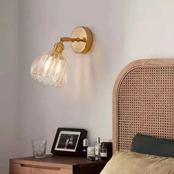Wall lamp with tulip-shaped glass shade in retro style