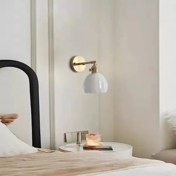 Wall lamp with tulip-shaped glass shade in retro style