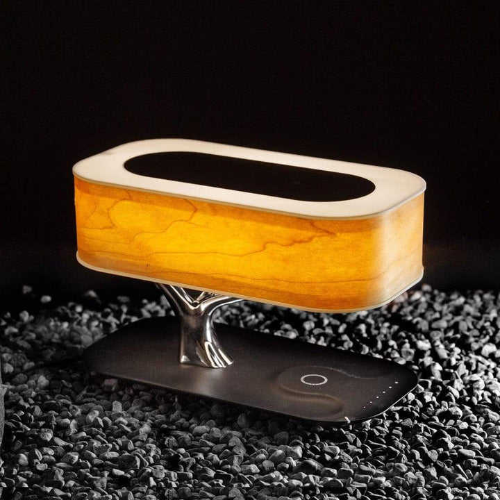 Designer LED table lamp with wood look, Bluetooth speaker and wireless charging function