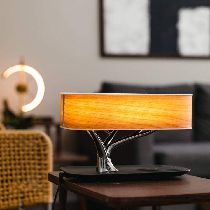 Designer LED table lamp with wood look, Bluetooth speaker and wireless charging function