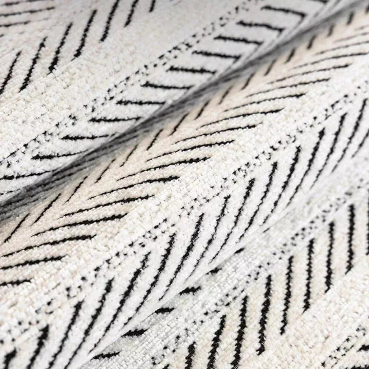 Sofa cover with herringbone pattern – throw with wavy edge