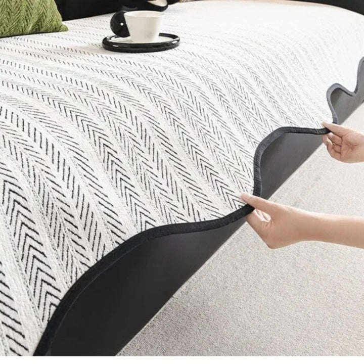 Sofa cover with herringbone pattern – throw with wavy edge