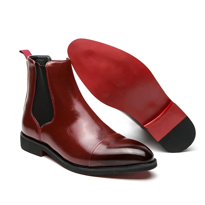 Men's Chelsea boots in black with red sole and pointed design