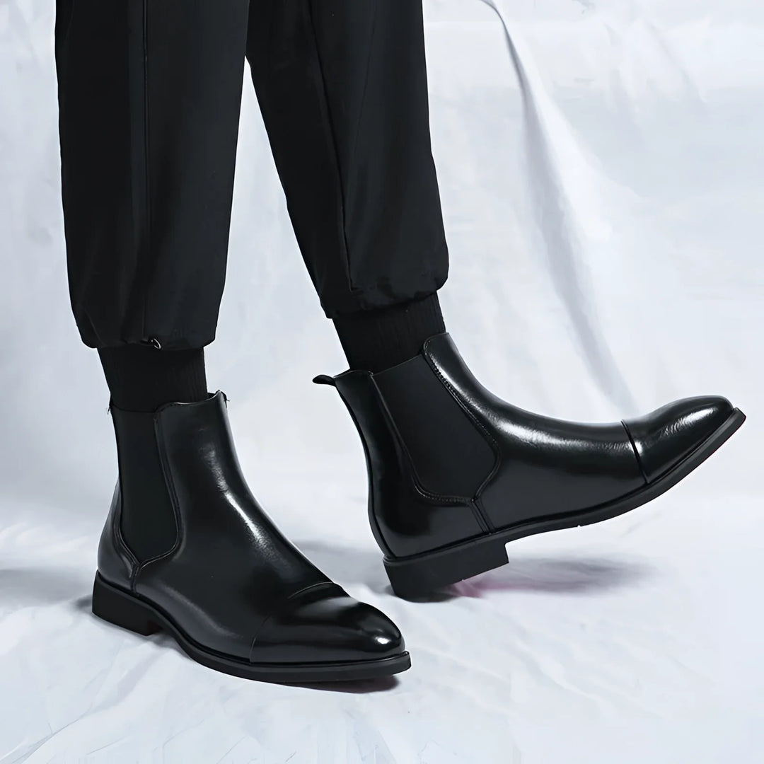 Men's Chelsea boots in black with red sole and pointed design
