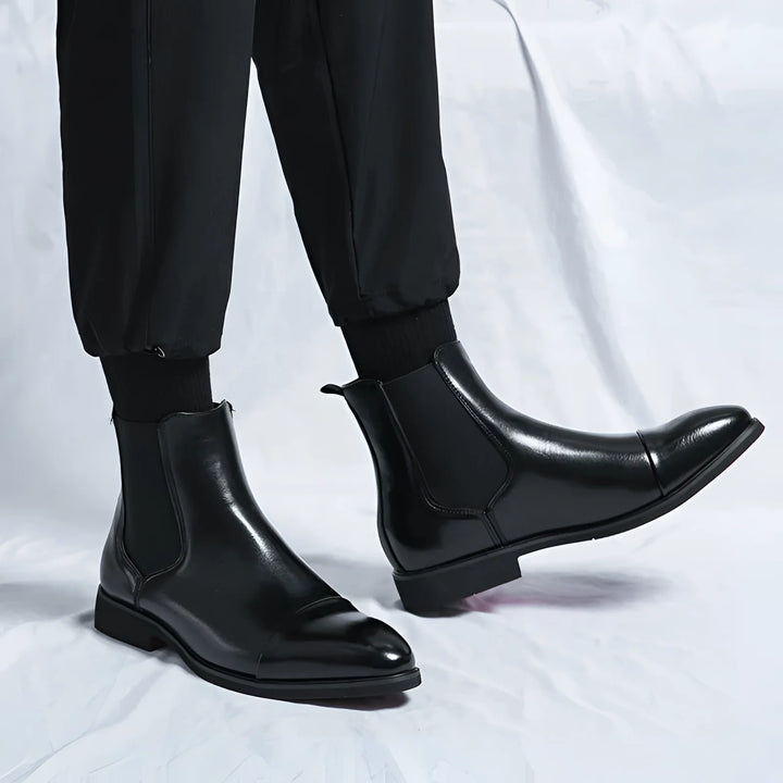 Men's Chelsea boots in black with red sole and pointed design