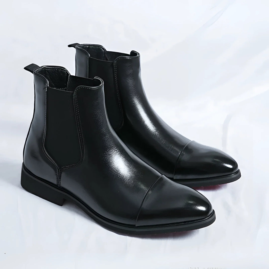 Men's Chelsea boots in black with red sole and pointed design