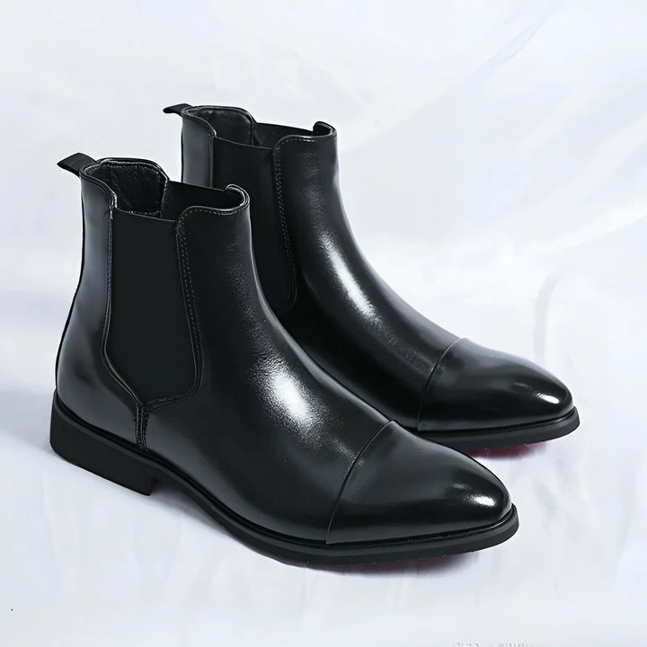 Men's Chelsea boots in black with red sole and pointed design