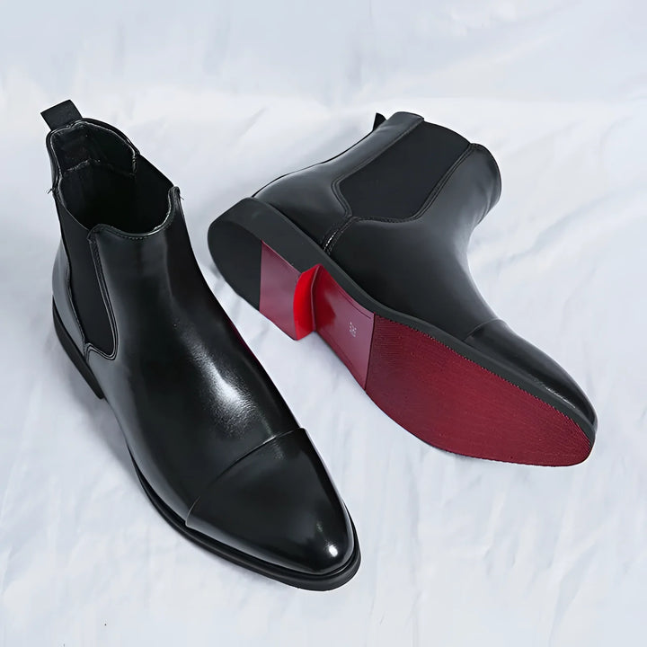 Men's Chelsea boots in black with red sole and pointed design