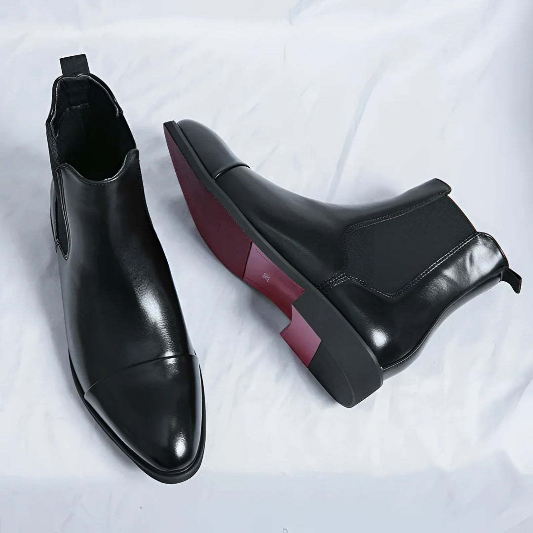 Men's Chelsea boots in black with red sole and pointed design