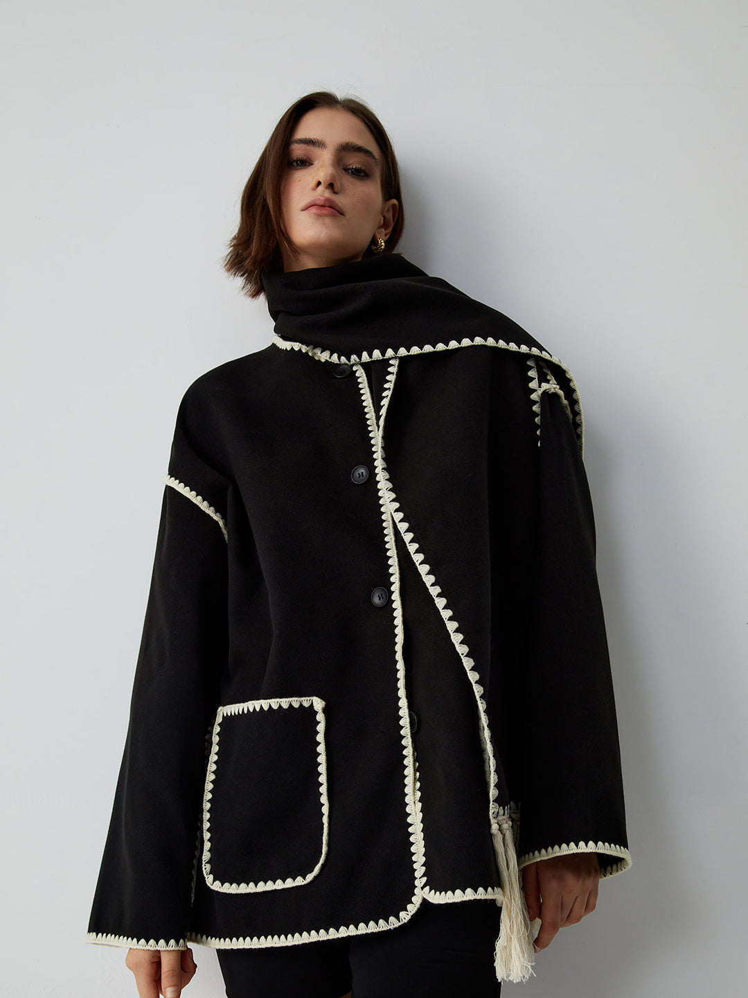 Women's coat with matching scarf and contrasting stitching